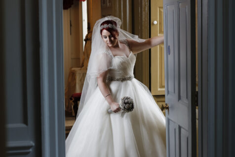 bride standing in a doorway in a Georgian house